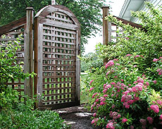 arched square lattice gate by Elyria Fence